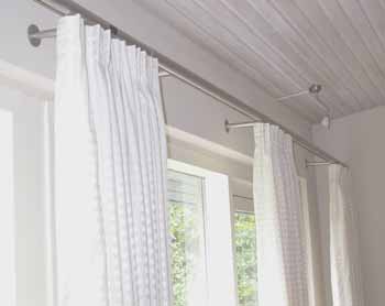Comfort curtain rails mounted in living room environment