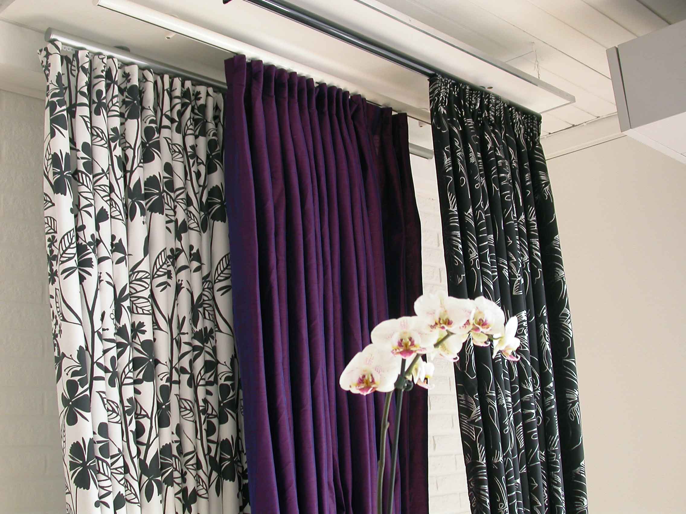 Classic curtain rods mounted in ceiling